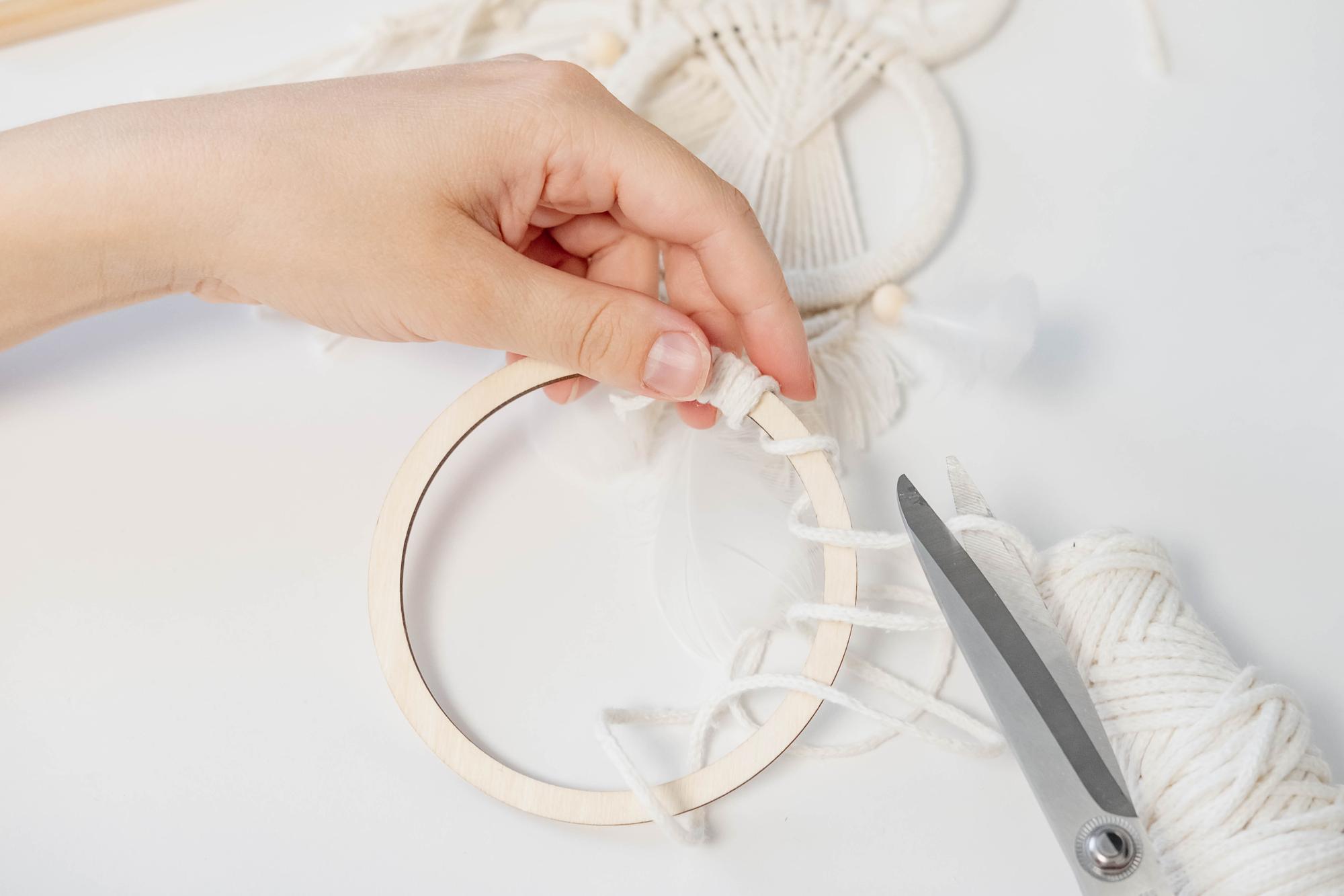 artisan embroiderer at work with hoop
