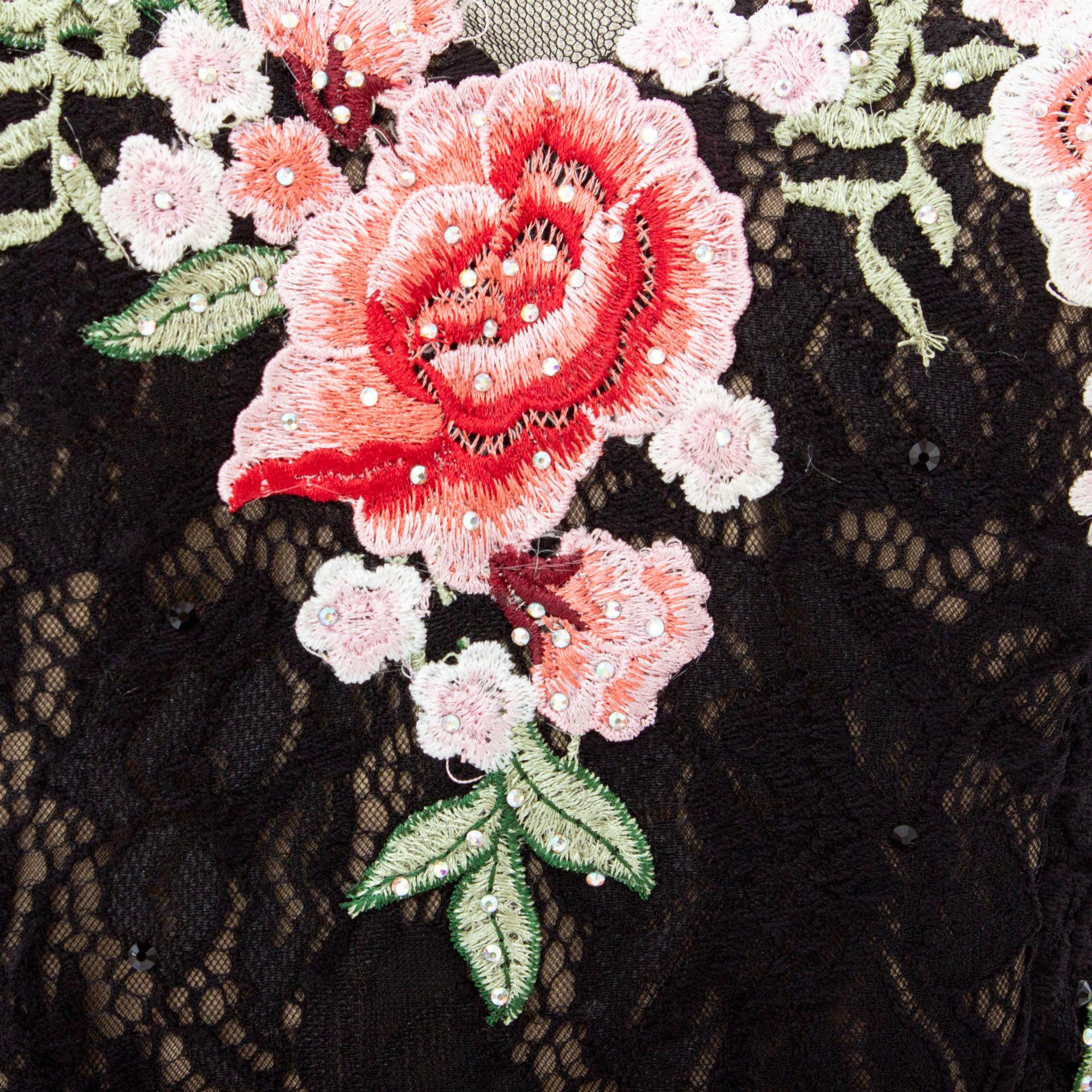 embroidered floral patch on linen