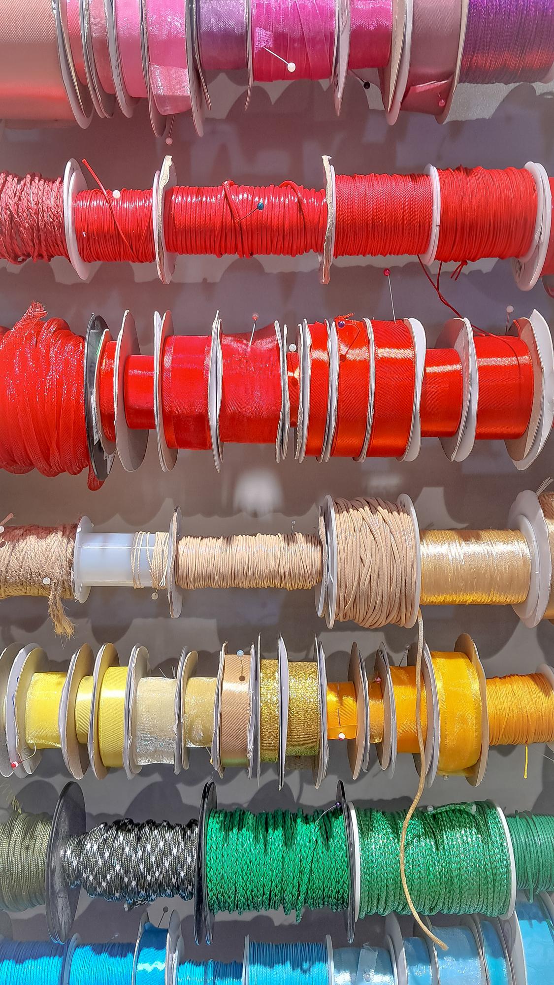 selection of embroidery threads and sample cards